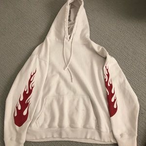 white hoodie with red flames on sleeves